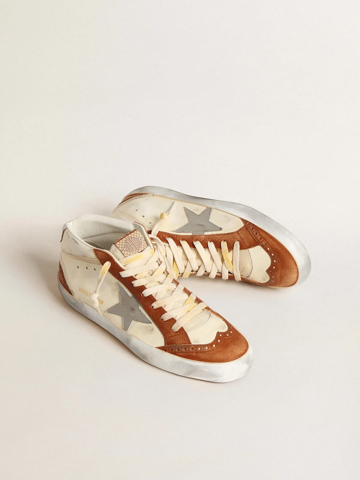 Mid Star LTD with gray leather star and beige cotton flash