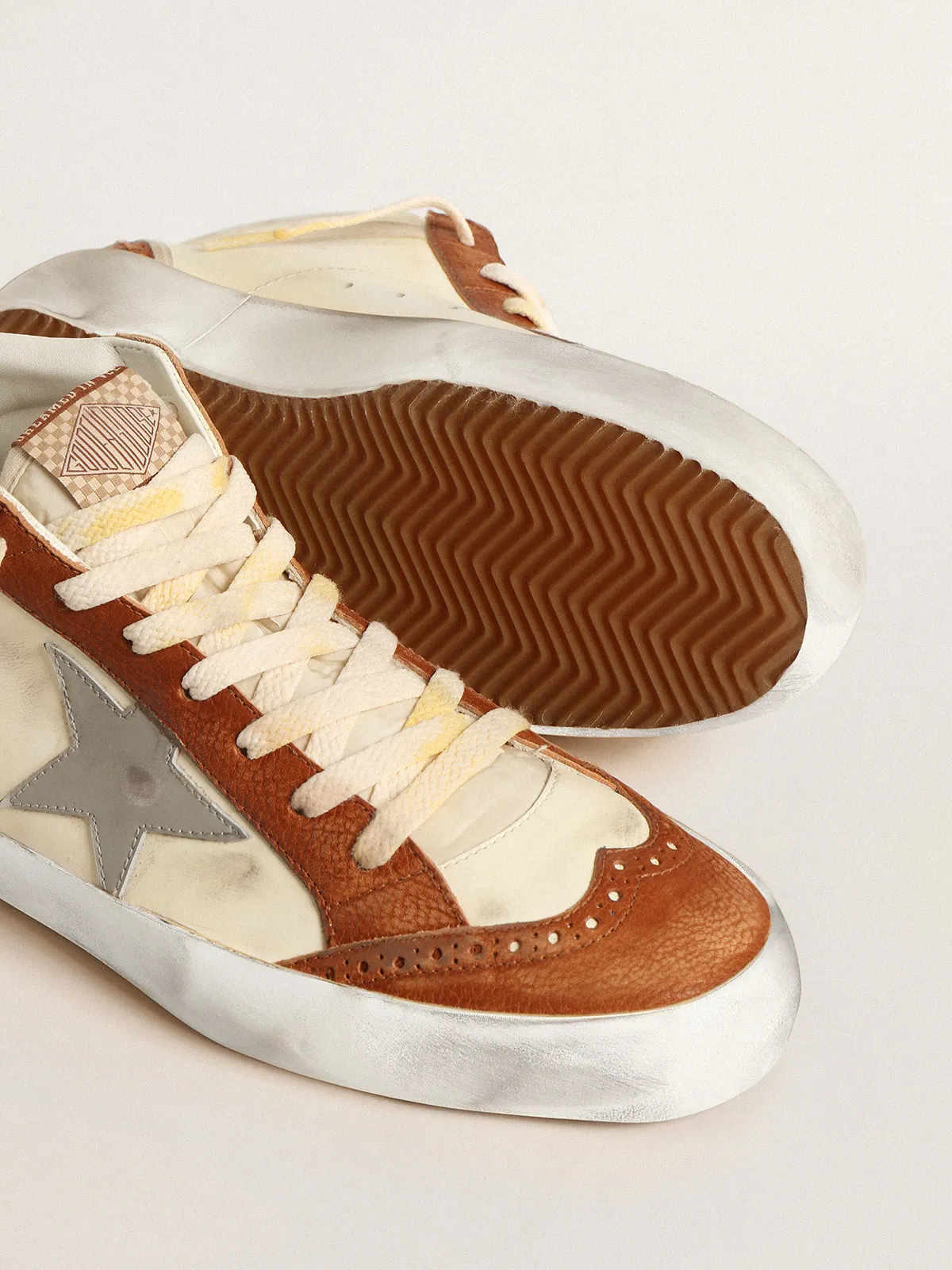 Mid Star LTD with gray leather star and beige cotton flash
