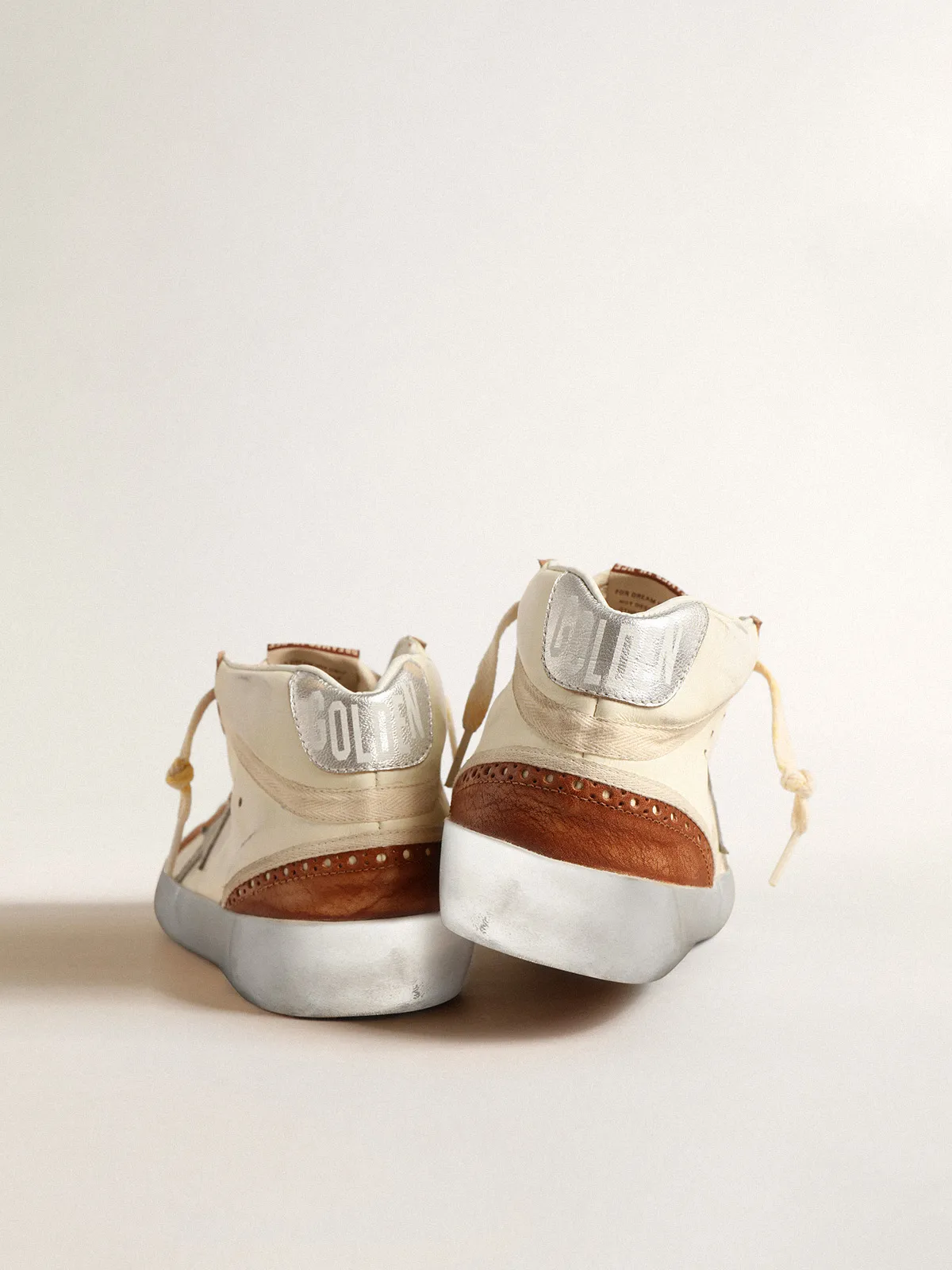 Mid Star LTD with gray leather star and beige cotton flash